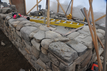 Work on the greenhouse foundation wall is progressing inside the hooch.