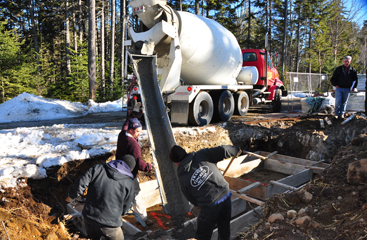 pouring slab for restroom The crew from Barry Concrete pours the footings for the restrooms.