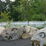 Stone Wall Dragons by Carole Hanson. B Freeman Two of the three Stone Wall Dragons by Carole Hanson - in the Children's Garden