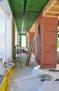 A view east down the classroom hallway. The large bay on right will house one of two room dividers that can divide the large space into two or three smaller ones as needed